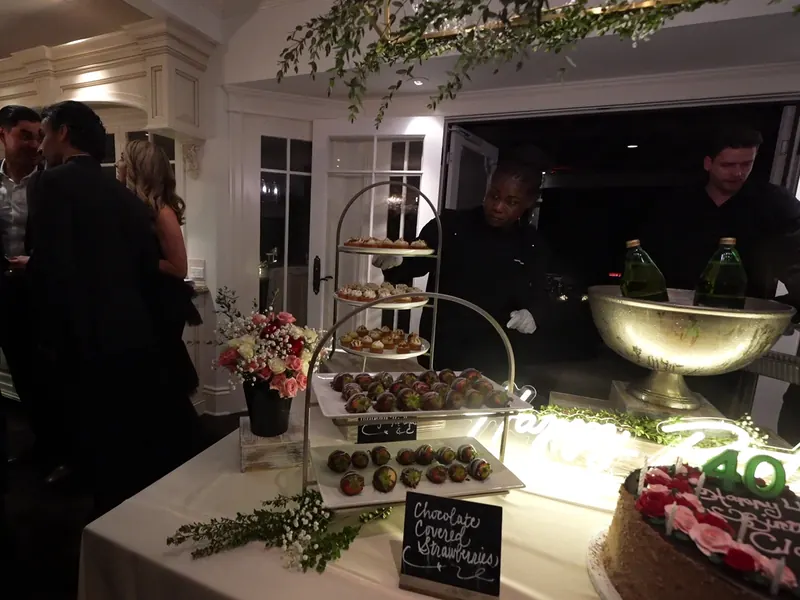 Milestone birthday dessert display with chilled champagne at a Fremont celebration