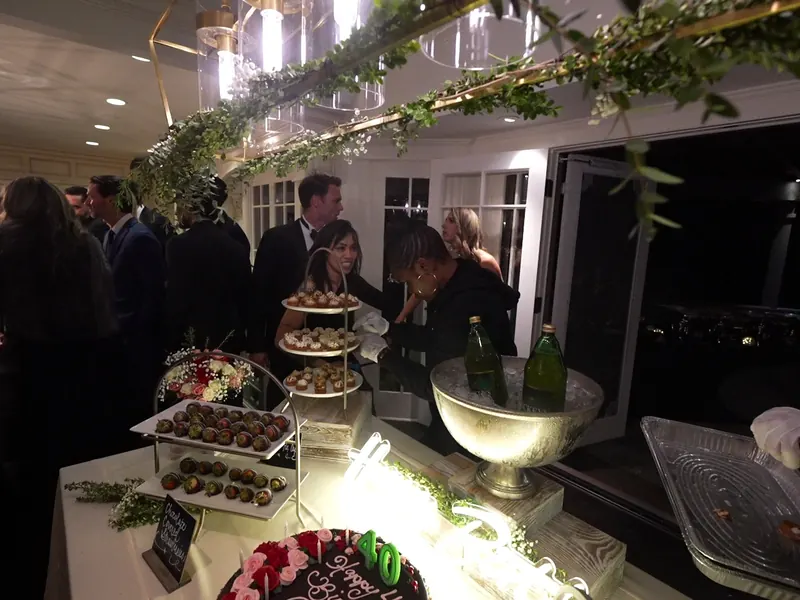 Birthday dessert display with chilled champagne and greenery at a Castro Valley celebration